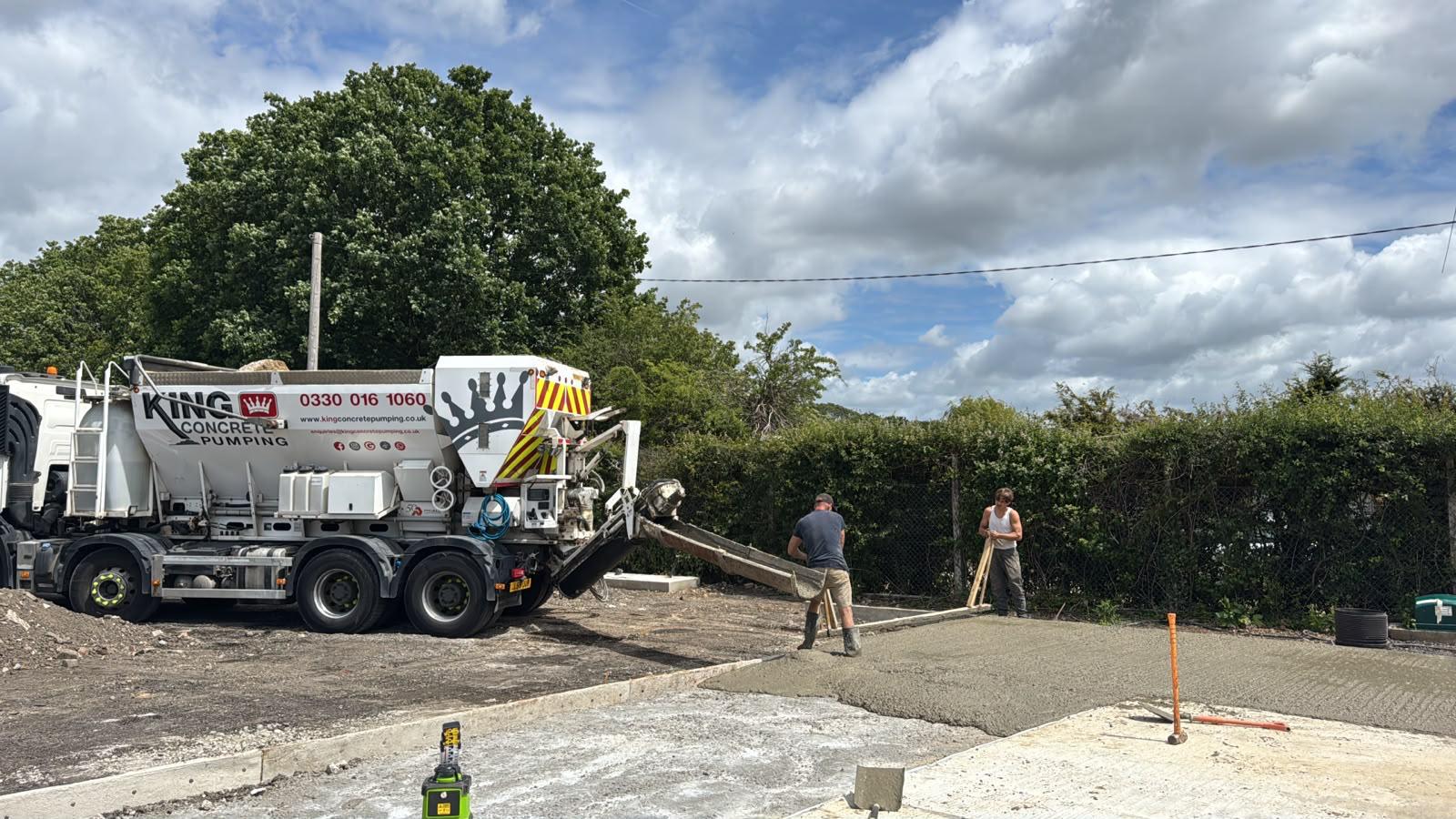 King Concrete Pumping crew placing concrete on a Reigate site